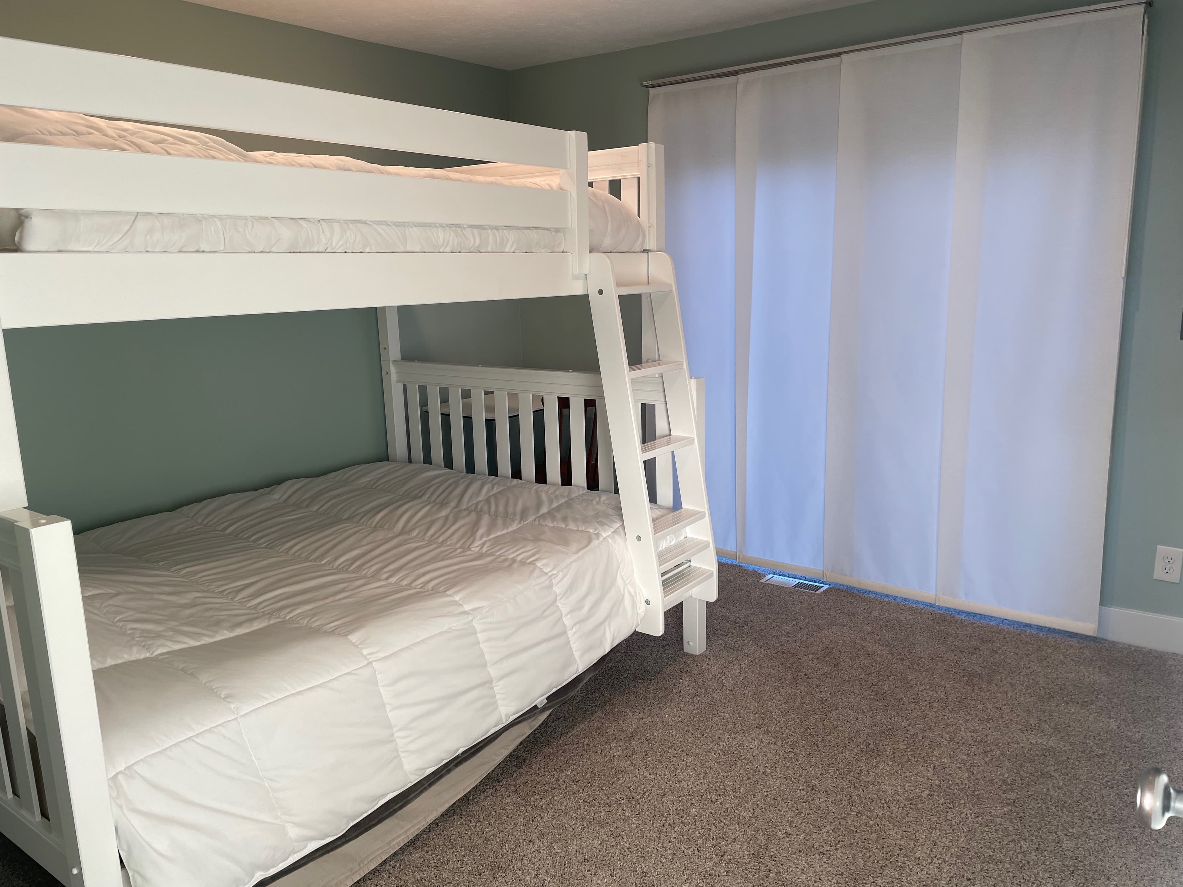 Third bedroom with full-over-queen bunk beds, perfect for kids or extra guests
